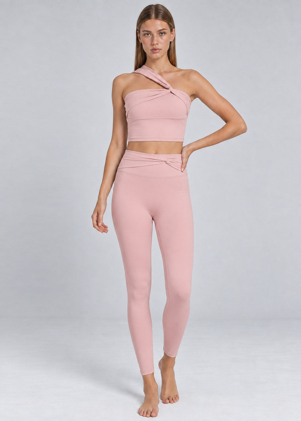 Blush pink one-shoulder crop top with crossover waist high-waisted leggings activewear set, full front view