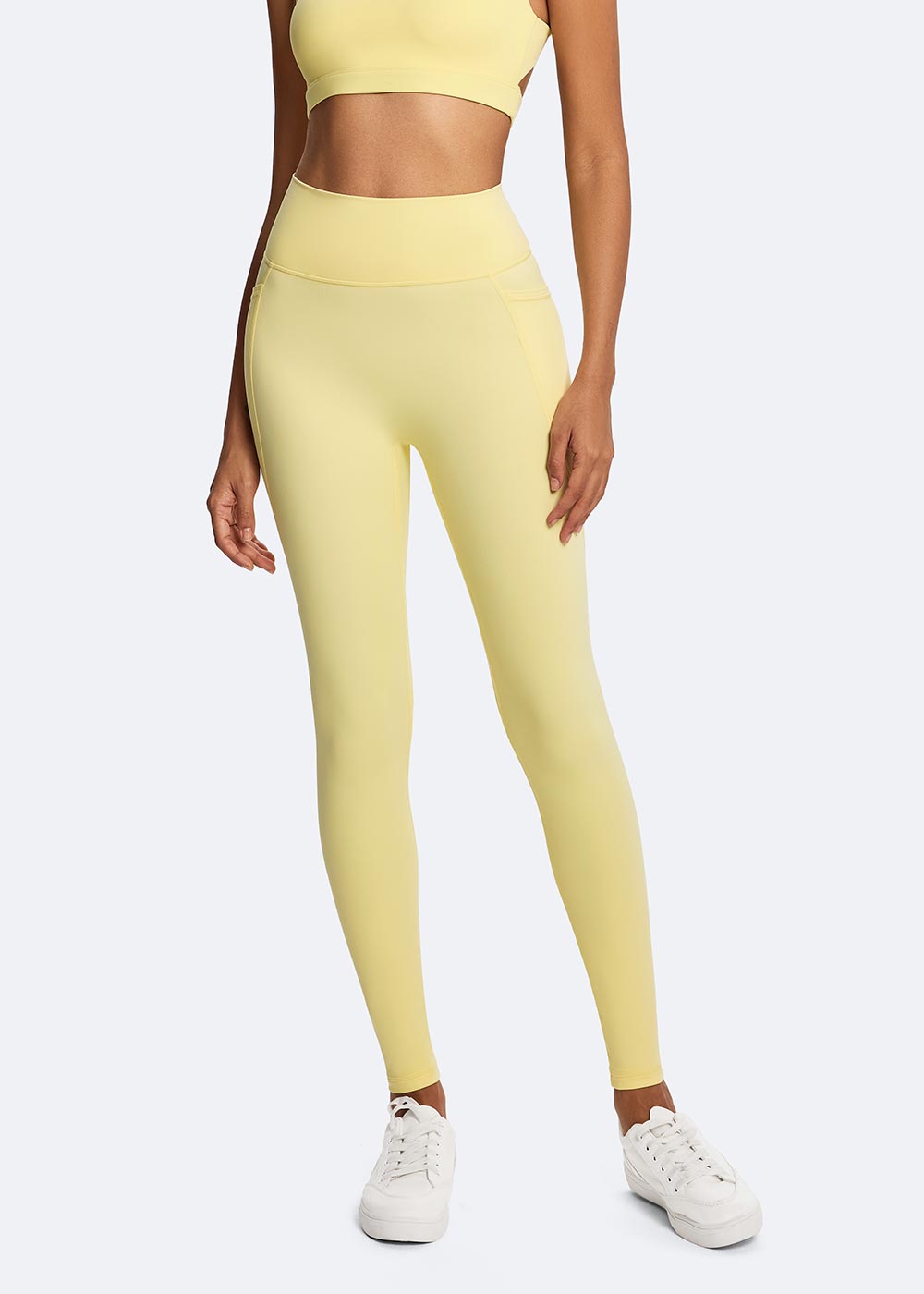 Women's Yellow Cloud-sensing Sports Legging with Pockets Close up of legs