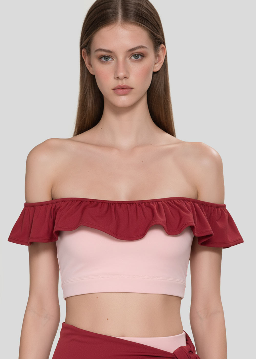 Women's blush pink off-shoulder crop top with burgundy ruffle neckline, front detail